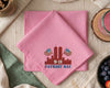 Pink handkerchief with 'Patriot Day' design on a table setting