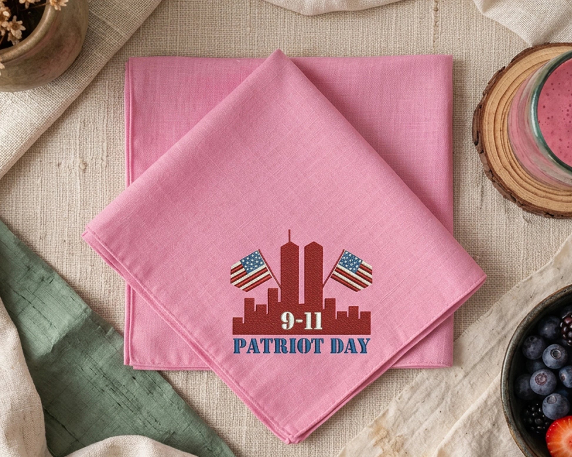 Pink handkerchief with 'Patriot Day' design on a table setting