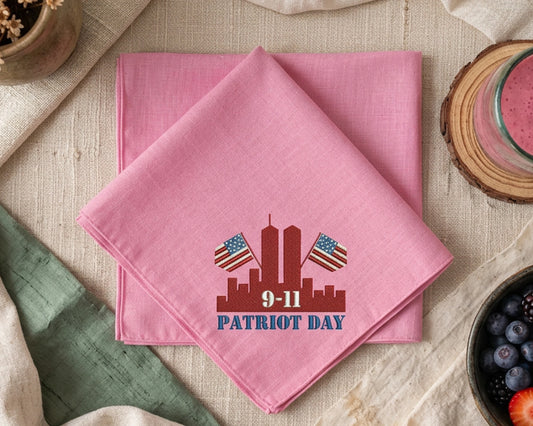 Pink handkerchief with 'Patriot Day' design on a table setting