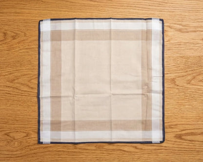 Plaid handkerchief on a wooden surface
