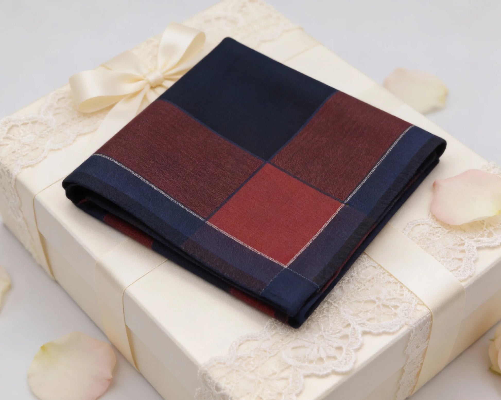 Plaid pocket square on a gift box with decorative elements
