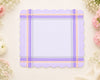 Purple plaid hanky with scalloped edges on a light background with flowers