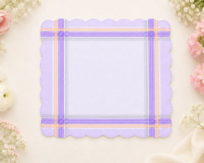 Purple plaid hanky with scalloped edges on a light background with flowers