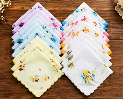Set of floral ladies handkerchiefs on a wooden surface