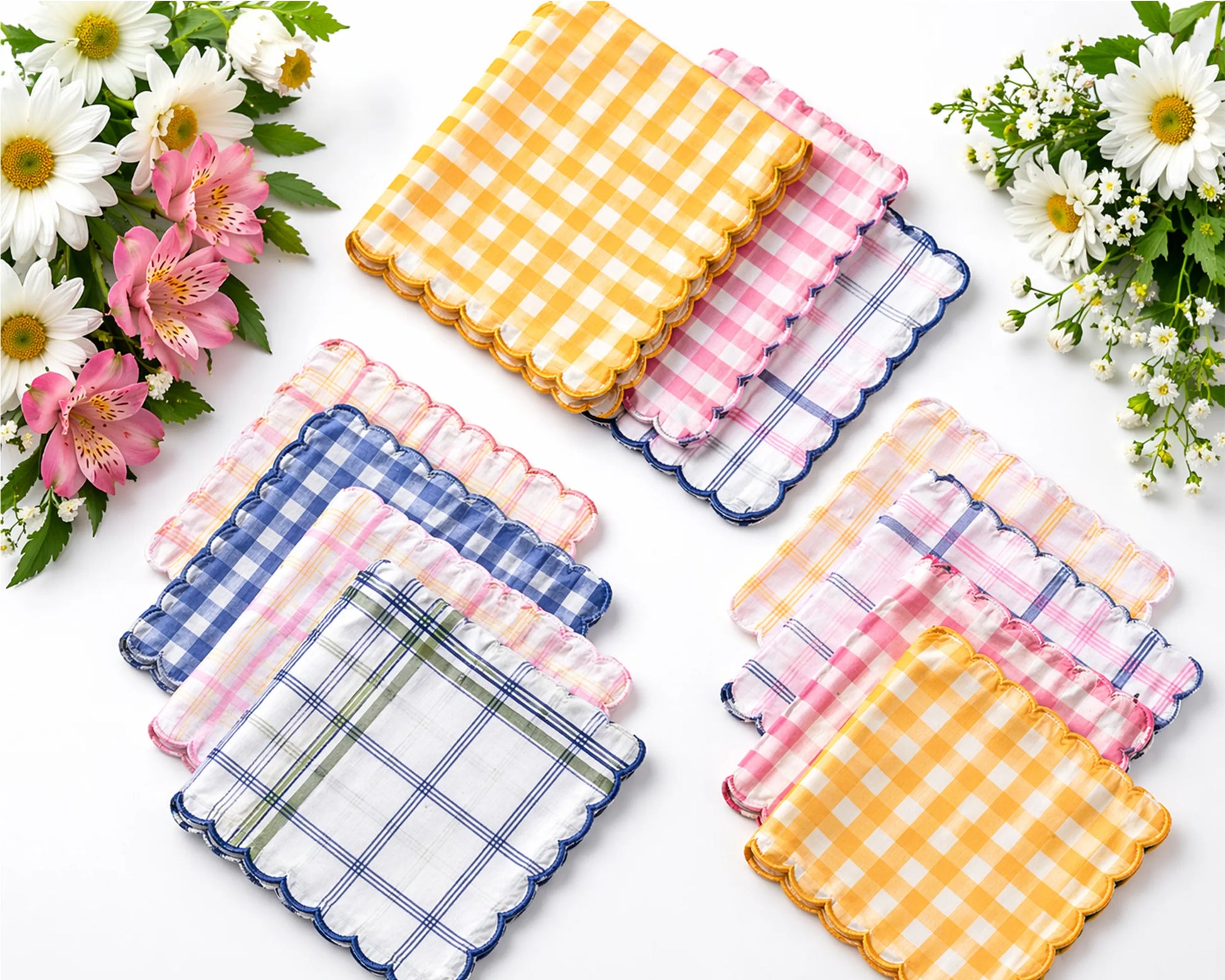 Set of colorful checkered coasters with flowers on a white background