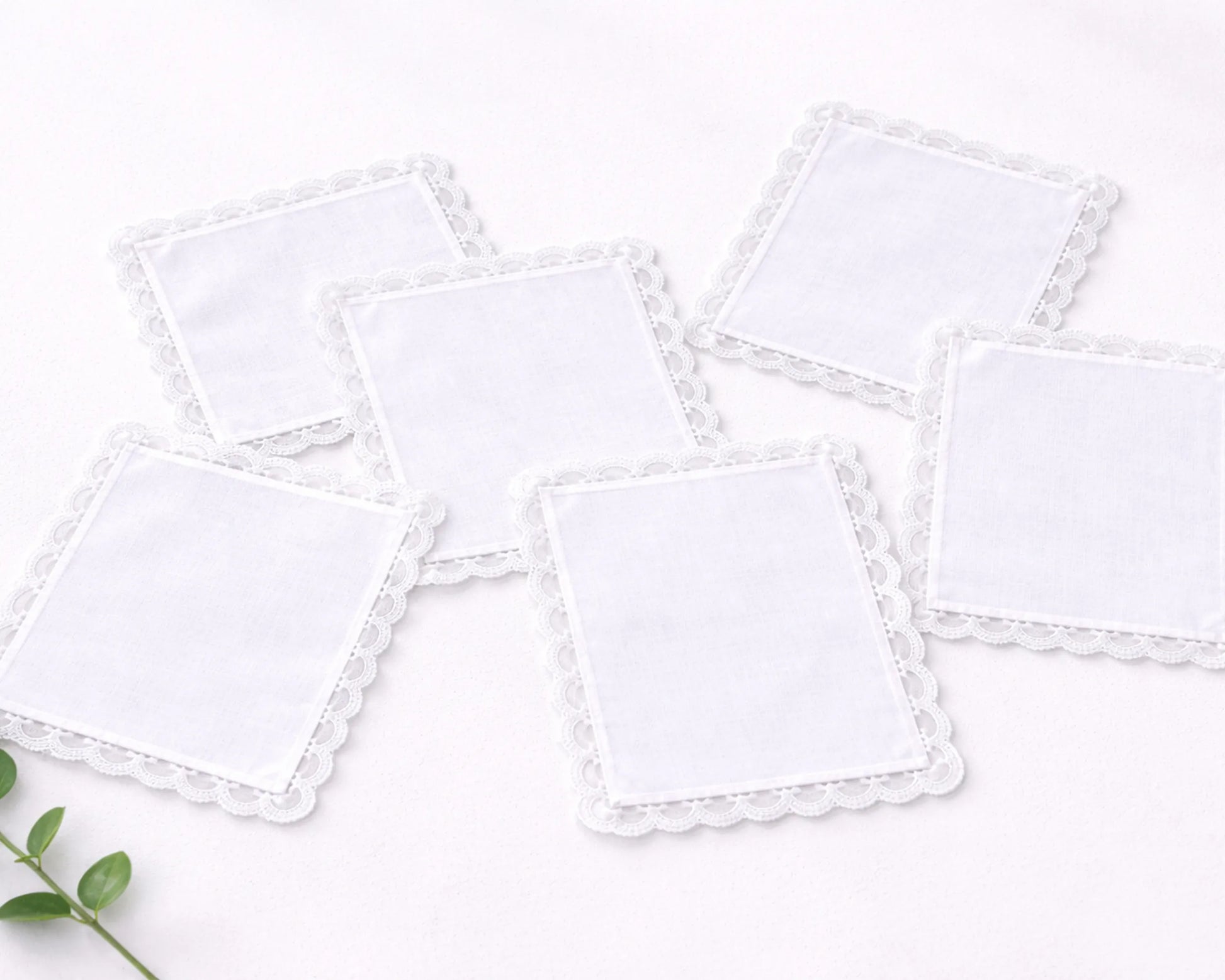Set of white square cloths on a light background