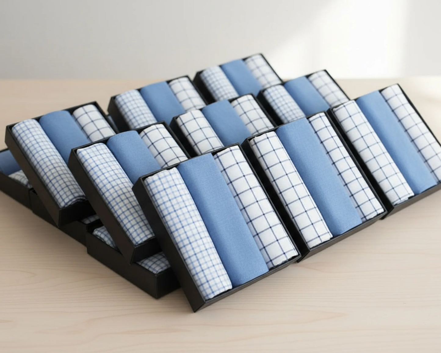 Set of blue and white checkered hanky on a wooden surface