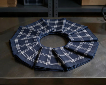 Set of blue plaid check hanky on a metallic surface