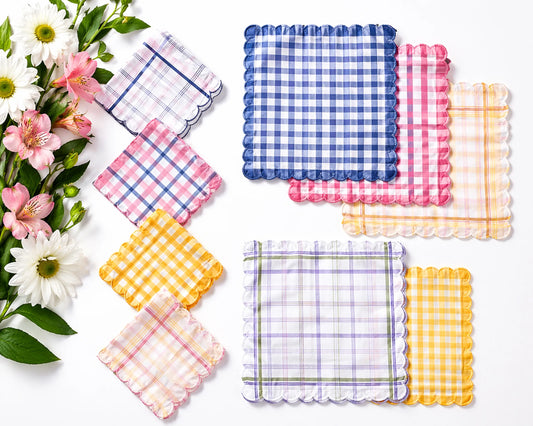 Set of colorful checkered coasters with flowers on a white background