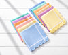 Set of colorful handkerchiefs on a light wooden surface
