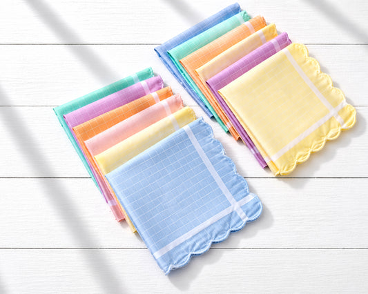 Set of colorful handkerchiefs on a light wooden surface
