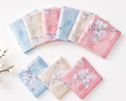 Set of floral-patterned handkerchiefs in pastel colors on a white background