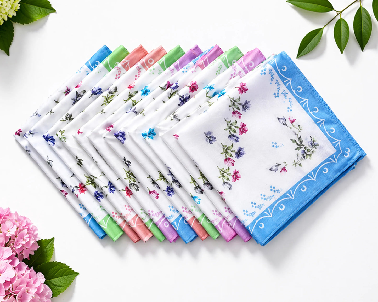 Set of floral handkerchiefs with a decorative box on a white background