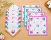Set of floral handkerchiefs on a wooden surface with decorative elements.