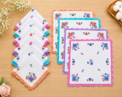 Set of floral handkerchiefs on a wooden surface with decorative elements.