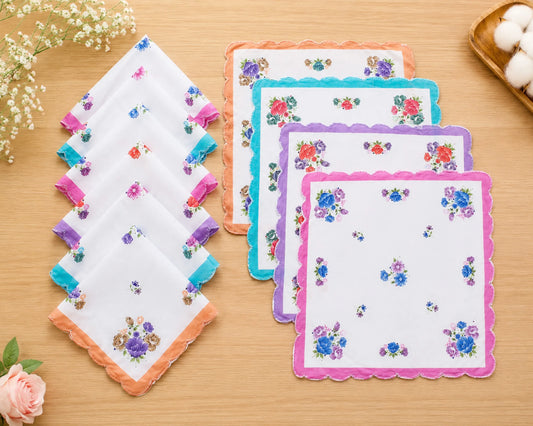 Set of floral handkerchiefs on a wooden surface with decorative elements.