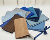 Set of folded colorful handkerchief on a wooden surface with a blurred background