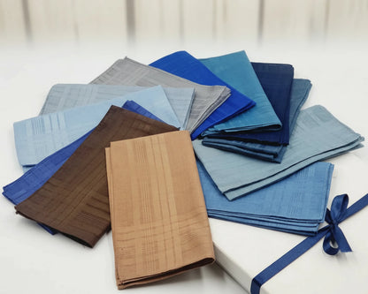Set of folded colorful handkerchief on a wooden surface with a blurred background