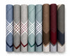 Set of folded fabric hanky in various patterns and colors on a white background