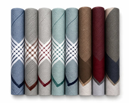 Set of folded fabric hanky in various patterns and colors on a white background