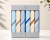 Set of folded hanky in a box with a neutral background