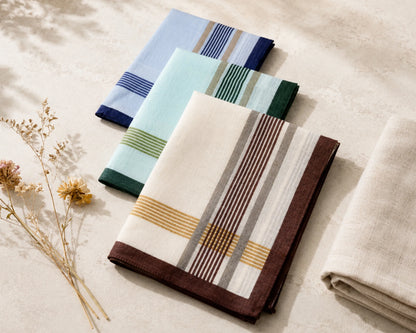 Set of folded hanky with striped patterns on a neutral background