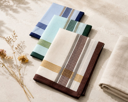 Set of folded hanky with striped patterns on a neutral background
