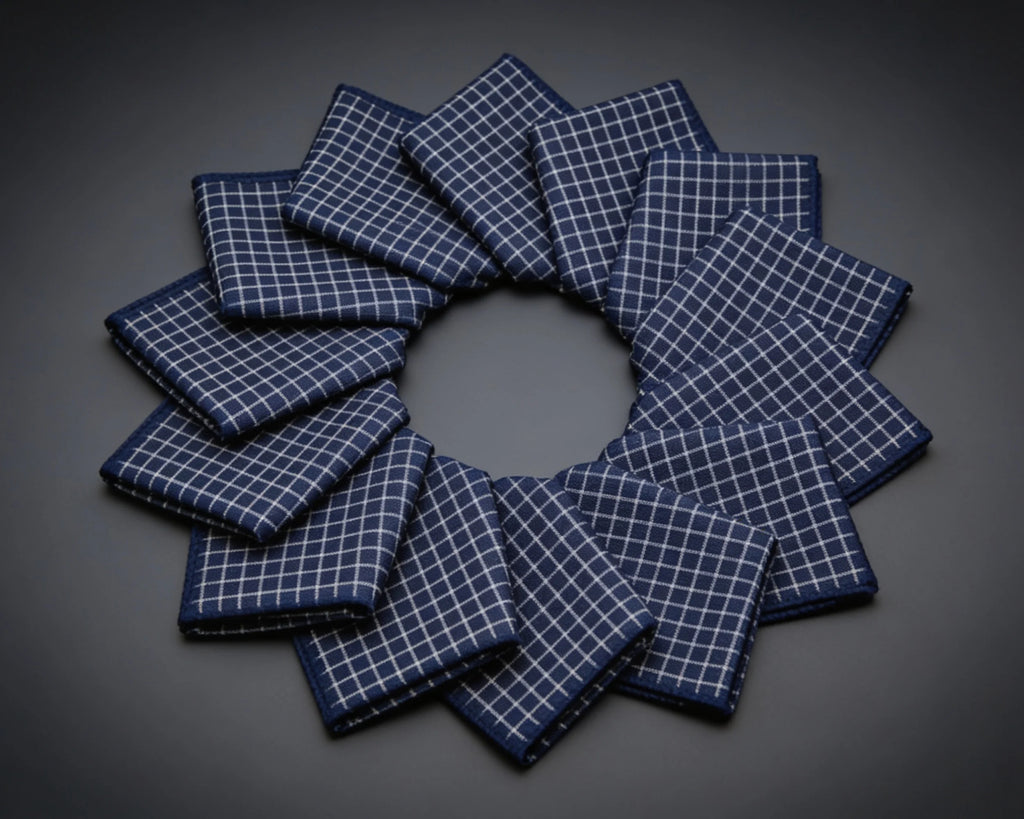 Set of gray checkered hanky arranged in a circular pattern on a wooden surface.