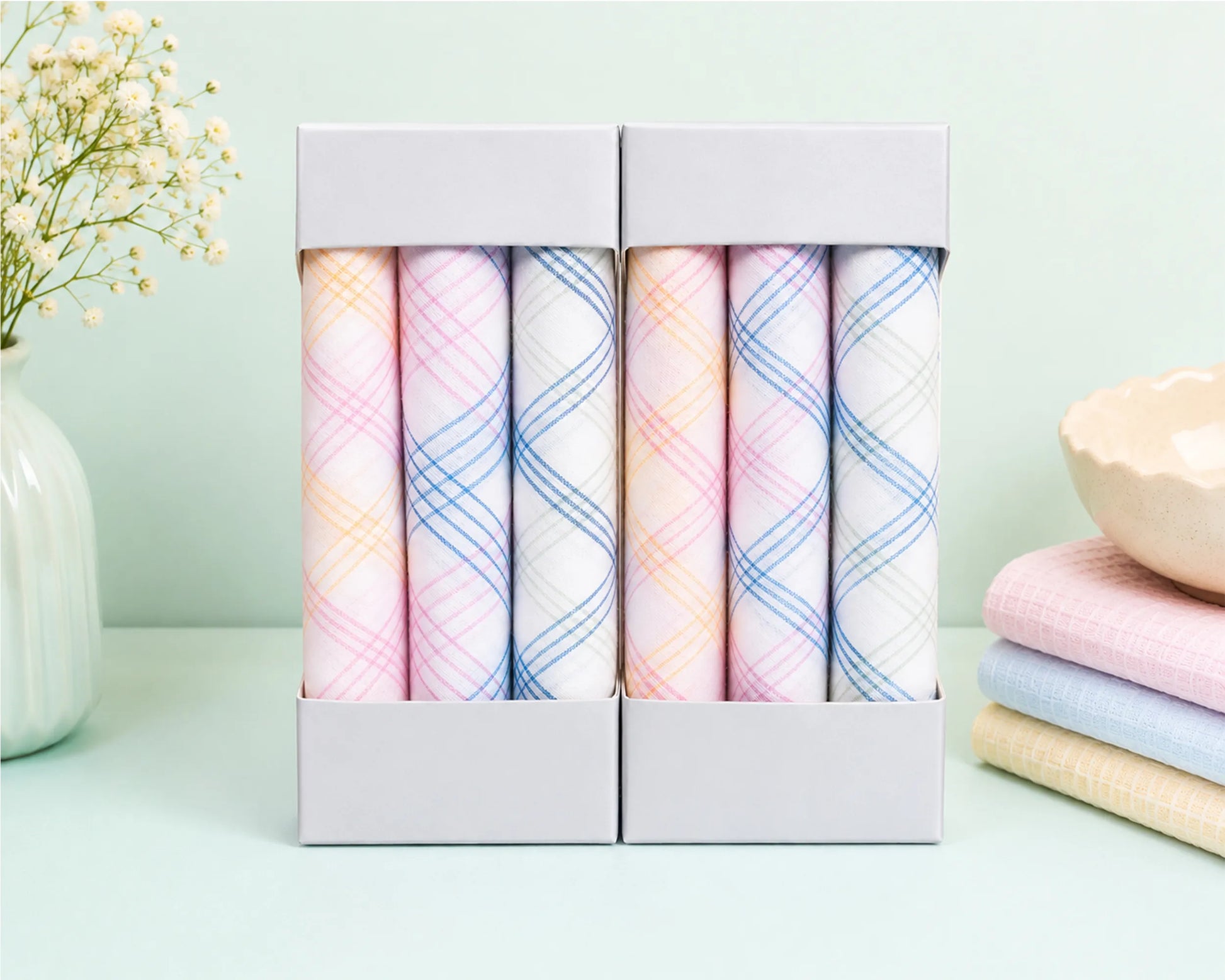 Set of pastel-colored plaid hanky in a box with a light green background