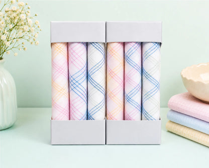 Set of pastel-colored plaid hanky in a box with a light green background
