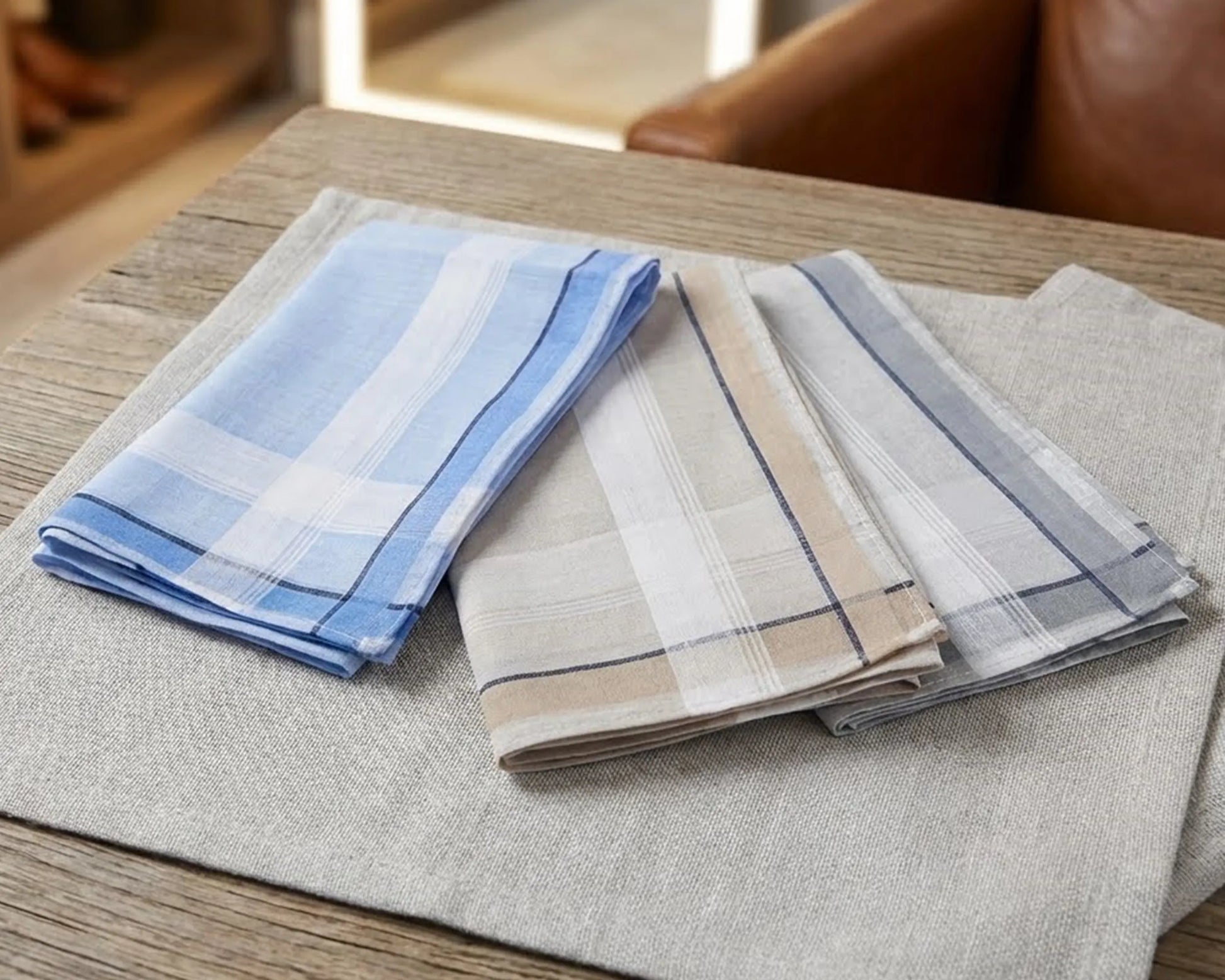 Set of plaid hanky on a wooden surface