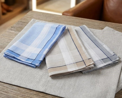 Set of plaid hanky on a wooden surface
