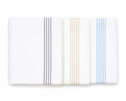 Set of three folded hanky with striped patterns on a white background