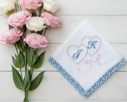 White cotton handkerchief for women showing a blue embroidered letter A with floral vine details and scalloped lace