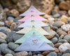 Small embroidered triangle flags on a bed of stones