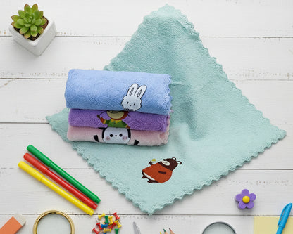 Single teal plush hankerchief for children featuring a small bear icon and wavy edges