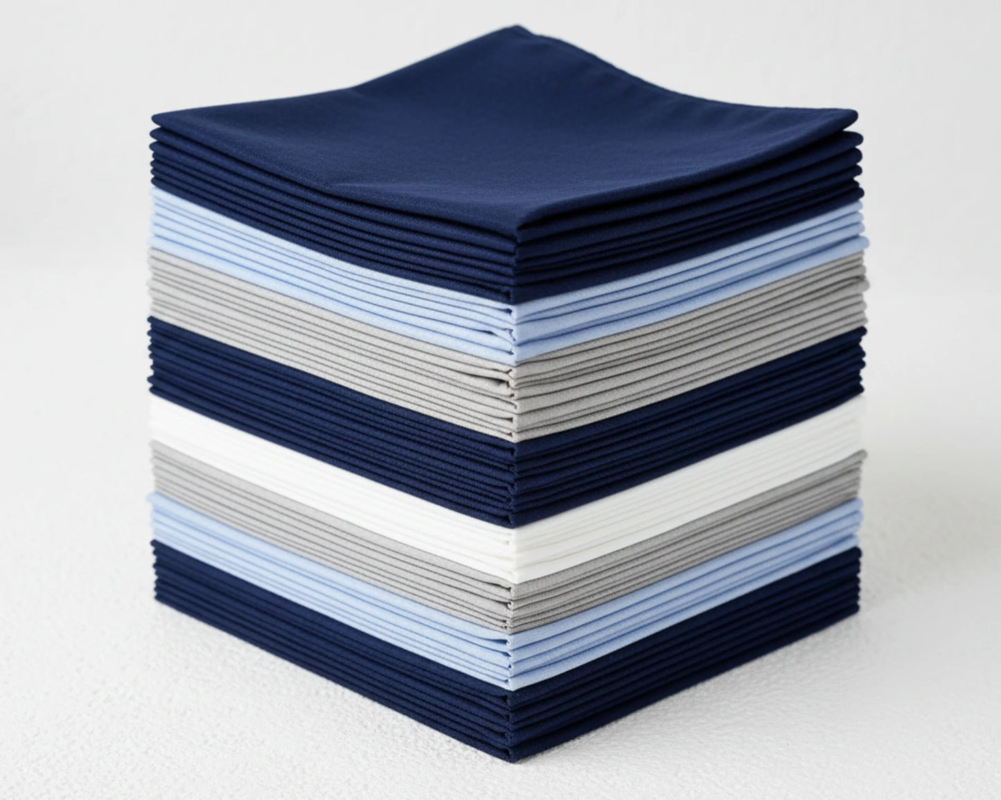 Stack of blue hanky on a dark surface