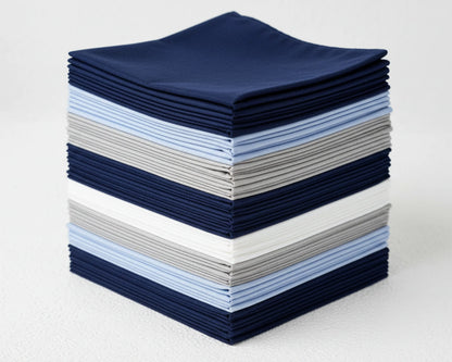 Stack of blue hanky on a dark surface