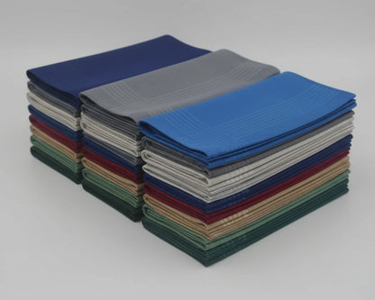 Stack of folded hanky in various colors on a white background