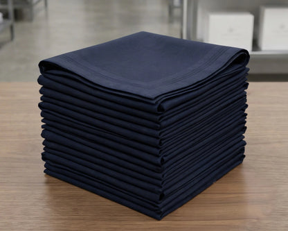 Stack of folded navy blue hanky on a wooden surface