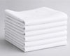 Stack of white folded hanky on a gray background