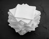 Stack of white hanky on a black background