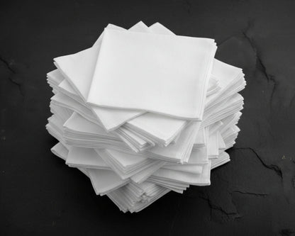 Stack of white hanky on a black background
