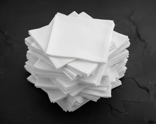 Stack of white hanky on a black background