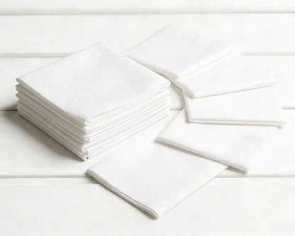 Stack of white hanky on a light wooden surface