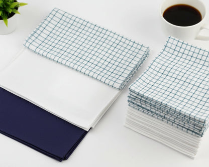 Stack of white hanky on a light wooden surface