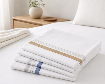 Stack of white hanky with brown and blue stripes on a white surface.