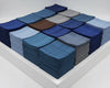 Stacks of blue hanky arranged in a grid on a white surface.