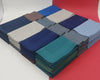Stacks of folded hanky in various colors on a white and red background