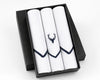 Three white handkerchiefs with a black deer emblem in a black box on a white background